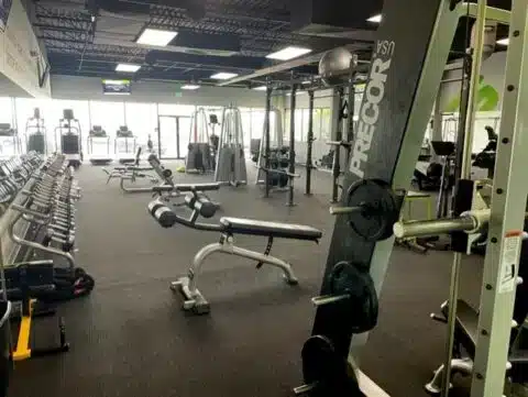 Dumbbell racks, benches, and strength-training equipment inside Shape Plus DTC